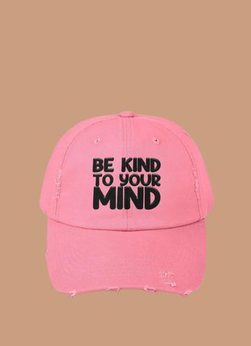 Pink cap with 'Be Kind To Your Mind' text on a white background