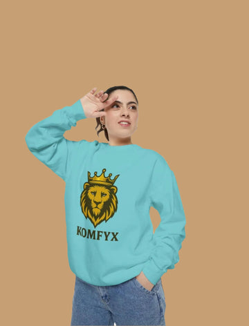 Person wearing a light blue sweatshirt with a lion graphic and 'KOMFYX' text on a white background